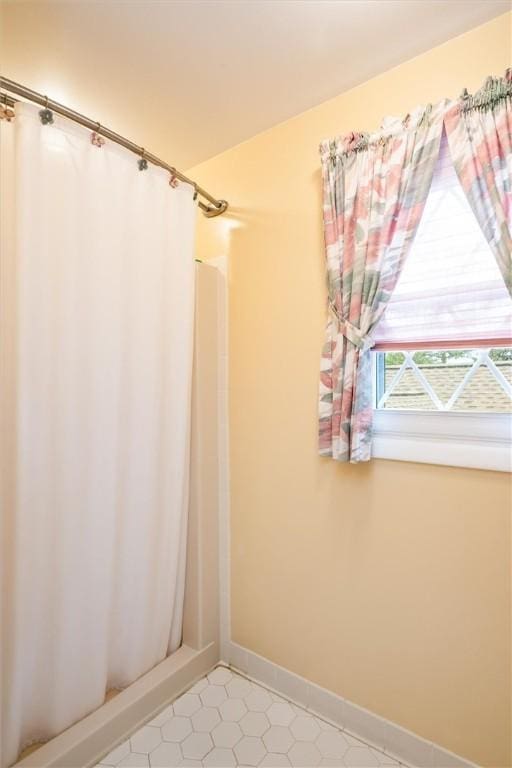 99 Old English Dr, Greece, NY 14616 - bathroom featuring curtained shower and tile patterned flooring