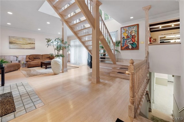 4582 Whetstone Rd, Manlius, NY 13104 - stairs with decorative columns, ornamental molding, wood finished floors, and recessed lighting