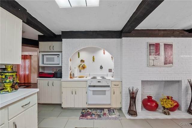 4582 Whetstone Rd, Manlius, NY 13104 - kitchen featuring white appliances, light countertops, light tile patterned floors, and beam ceiling