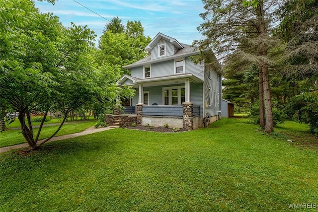 940 Town Line Rd, Lancaster, NY 14086 - view of front facade with a porch and a front lawn