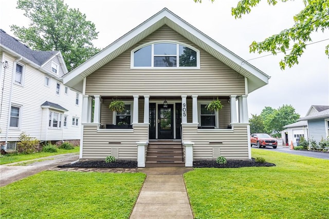 905 W Center St, Ridgeway, NY 14103 - view of front of house with covered porch and a front yard
