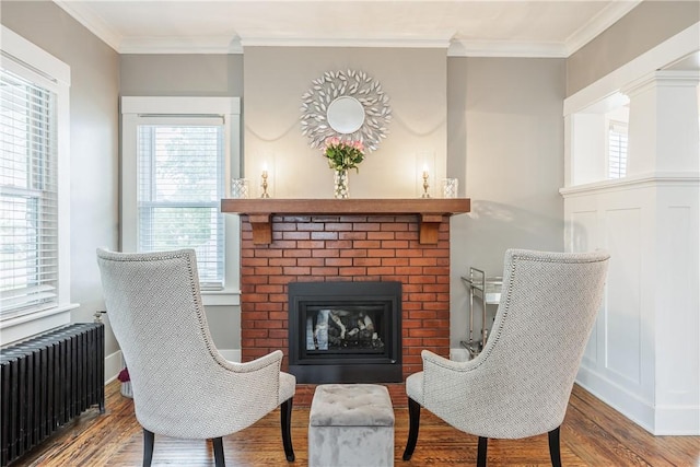 905 W Center St, Ridgeway, NY 14103 - sitting room featuring radiator, wood finished floors, healthy amount of natural light, and ornamental molding