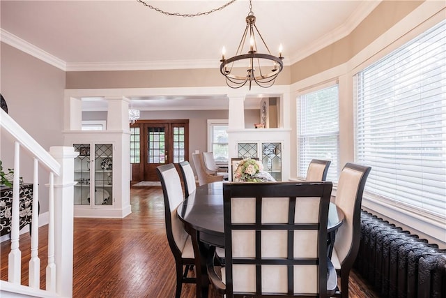 905 W Center St, Ridgeway, NY 14103 - dining room featuring a chandelier, ornamental molding, wood finished floors, ornate columns, and stairs