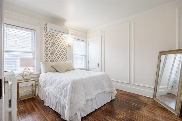 905 W Center St, Ridgeway, NY 14103 - bedroom featuring a wall mounted air conditioner, dark wood-style floors, ornamental molding, and a decorative wall