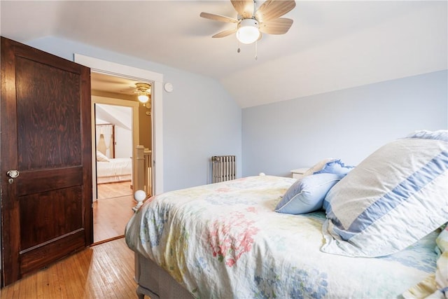 905 W Center St, Ridgeway, NY 14103 - bedroom featuring vaulted ceiling, light wood-style flooring, radiator, and ceiling fan