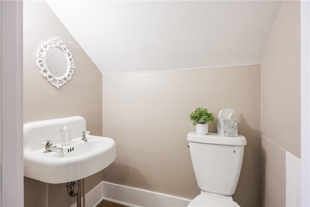 905 W Center St, Ridgeway, NY 14103 - bathroom with lofted ceiling and toilet