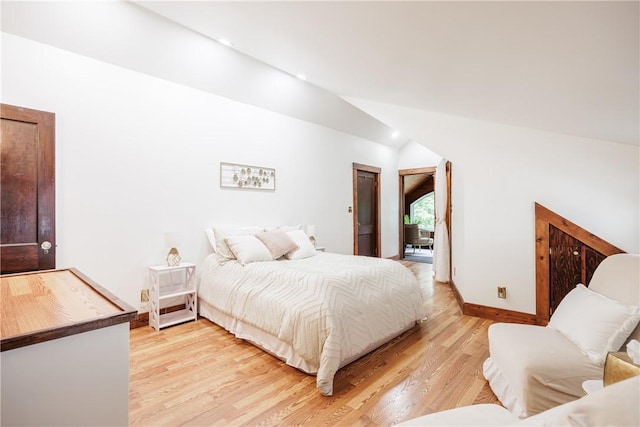 905 W Center St, Ridgeway, NY 14103 - bedroom with vaulted ceiling and light wood finished floors