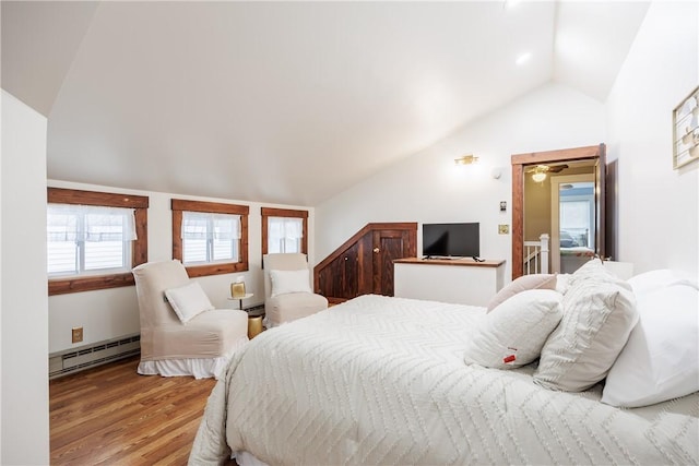 905 W Center St, Ridgeway, NY 14103 - bedroom featuring baseboard heating, lofted ceiling, and wood finished floors