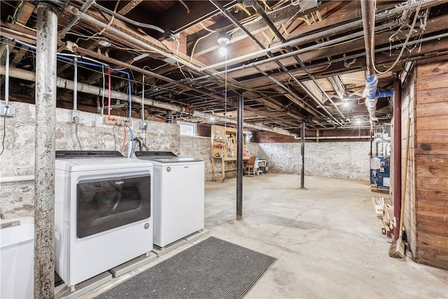 905 W Center St, Ridgeway, NY 14103 - unfinished below grade area featuring washing machine and clothes dryer and a heating unit