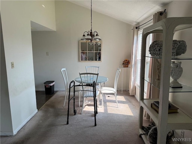 73 Henel Ave Unit 5, Amherst, NY 14226 - carpeted dining room featuring lofted ceiling and a chandelier