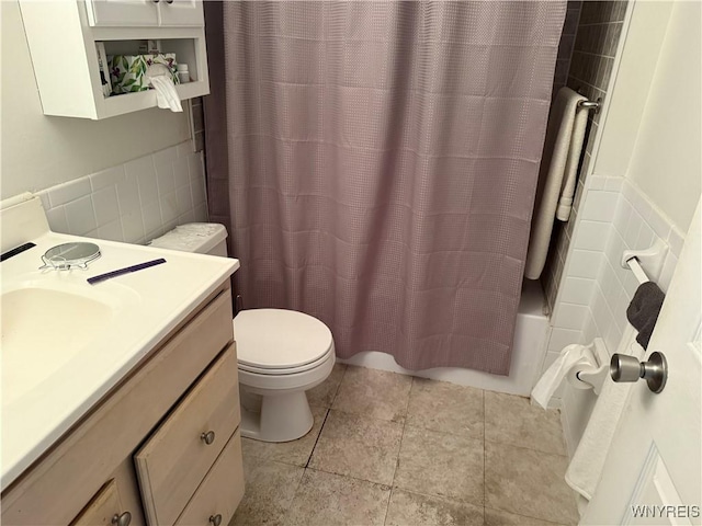 73 Henel Ave Unit 5, Amherst, NY 14226 - bathroom featuring tile walls, vanity, shower / bath combo, and wainscoting