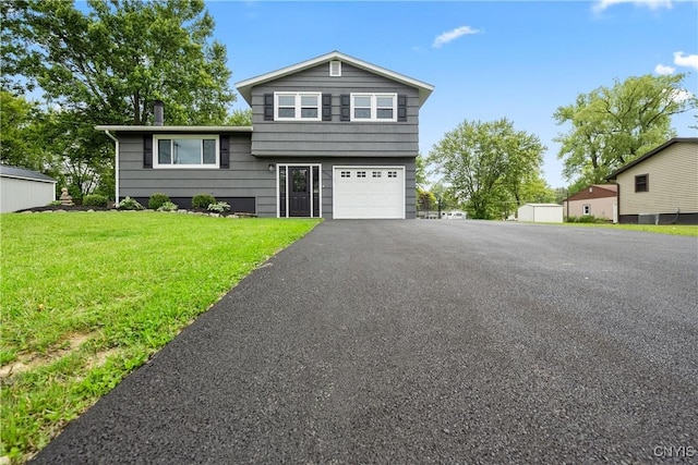 8478 Grandview Dr, Cicero, NY 13039 - tri-level home with a front yard, driveway, and a garage