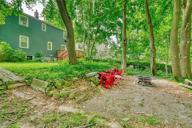 244 Highland Pkwy, Rochester, NY 14620 - view of yard featuring a fire pit and a wooden deck
