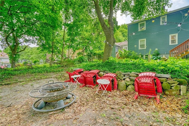 244 Highland Pkwy, Rochester, NY 14620 - view of yard with an outdoor fire pit and stairway