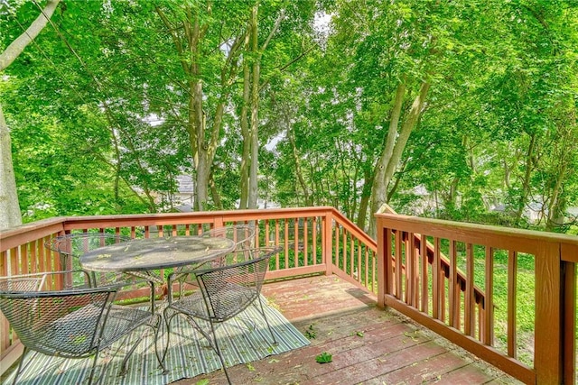 244 Highland Pkwy, Rochester, NY 14620 - deck with outdoor dining area and view of wooded area