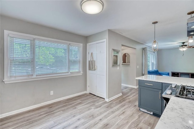 244 Highland Pkwy, Rochester, NY 14620 - kitchen featuring light countertops, light wood-style flooring, decorative light fixtures, ceiling fan, and open floor plan