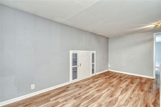 244 Highland Pkwy, Rochester, NY 14620 - unfurnished room featuring wood finished floors and baseboards