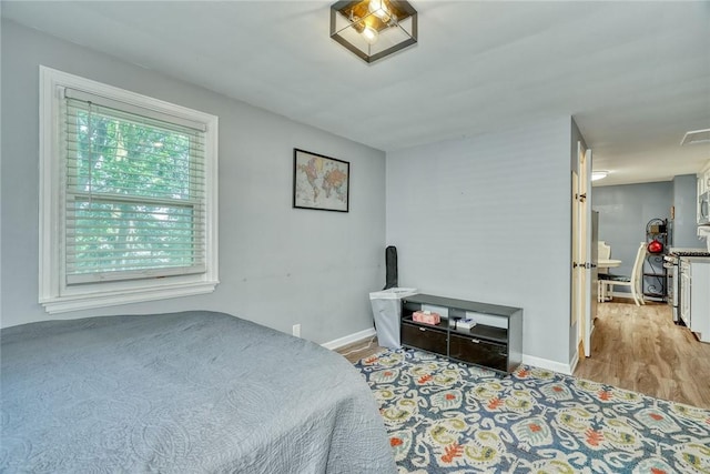 244 Highland Pkwy, Rochester, NY 14620 - bedroom featuring light wood finished floors and baseboards