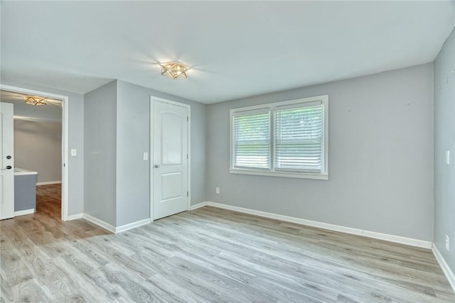244 Highland Pkwy, Rochester, NY 14620 - unfurnished bedroom featuring wood finished floors and baseboards