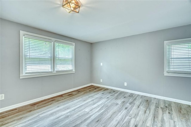 244 Highland Pkwy, Rochester, NY 14620 - spare room with wood finished floors and baseboards