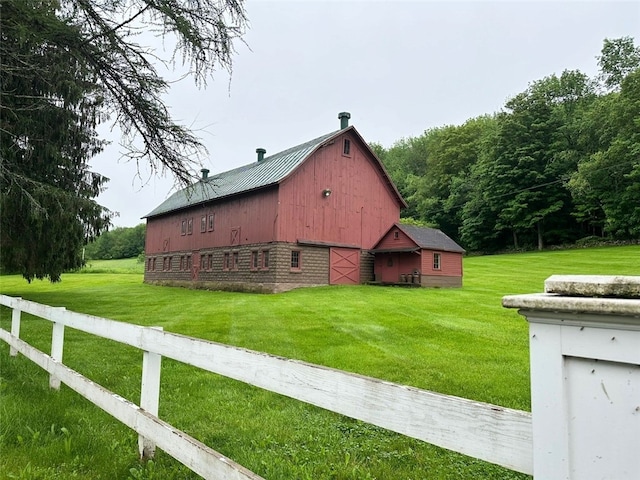 6806 County Highway 14, Meredith, NY 13846 - view of home's exterior featuring a barn, an outbuilding, a detached garage, and a metal roof