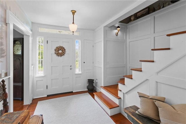 6806 County Highway 14, Meredith, NY 13846 - foyer entrance featuring stairway, wood finished floors, and a decorative wall