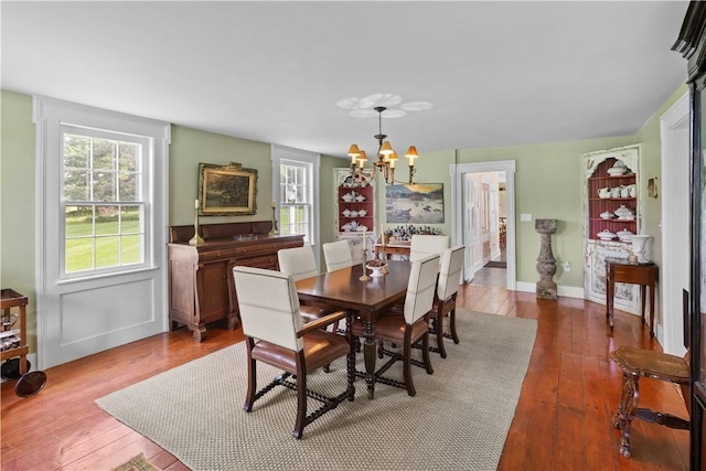 6806 County Highway 14, Meredith, NY 13846 - dining area with a chandelier and hardwood / wood-style floors
