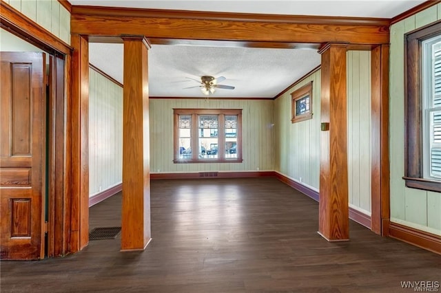 373 Urban St, Buffalo, NY 14211 - spare room featuring a ceiling fan, crown molding, dark wood-style flooring, and wood walls