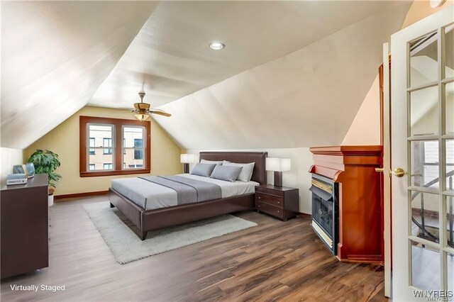 373 Urban St, Buffalo, NY 14211 - bedroom with dark wood finished floors, lofted ceiling, and ceiling fan