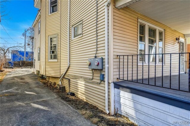 373 Urban St, Buffalo, NY 14211 - view of side of property featuring a porch and asphalt driveway