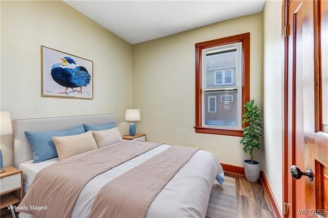 373 Urban St, Buffalo, NY 14211 - bedroom featuring wood finished floors and baseboards