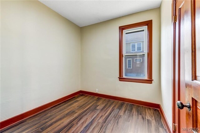 373 Urban St, Buffalo, NY 14211 - spare room with dark wood-style floors and baseboards
