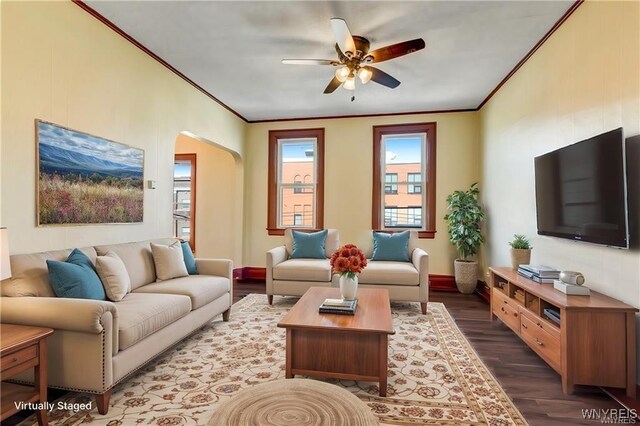 373 Urban St, Buffalo, NY 14211 - living room with ornamental molding, a ceiling fan, wood finished floors, and arched walkways
