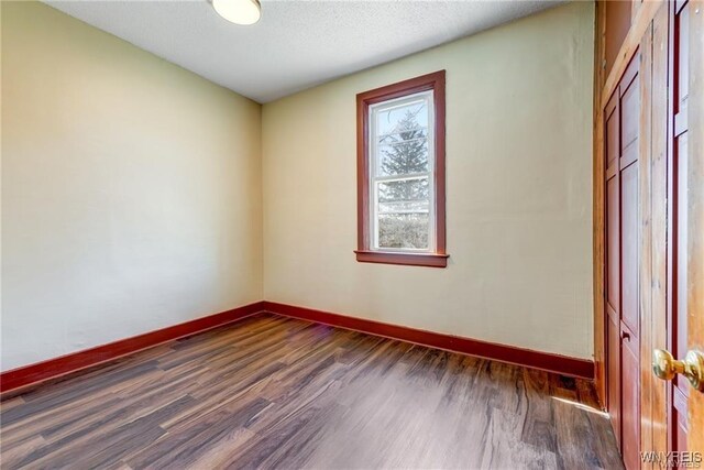 373 Urban St, Buffalo, NY 14211 - unfurnished room with dark wood-style floors and a textured ceiling