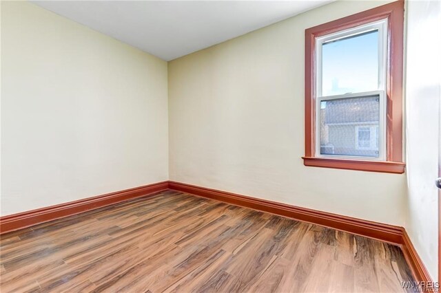 373 Urban St, Buffalo, NY 14211 - empty room with wood finished floors and baseboards
