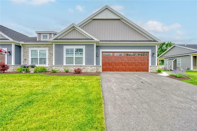 1391 Creeks Edge Dr, Webster, NY 14580 - craftsman-style house with stone siding, board and batten siding, a garage, and driveway