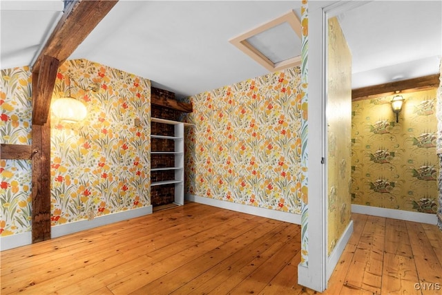 9999 Pierce Rd N, Trenton, NY 13354 - empty room featuring wallpapered walls and hardwood / wood-style floors
