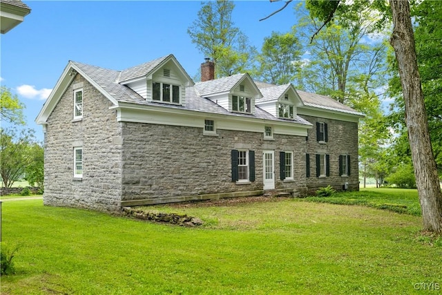 9999 Pierce Rd N, Trenton, NY 13354 - view of front facade with a chimney, stone siding, and a front yard