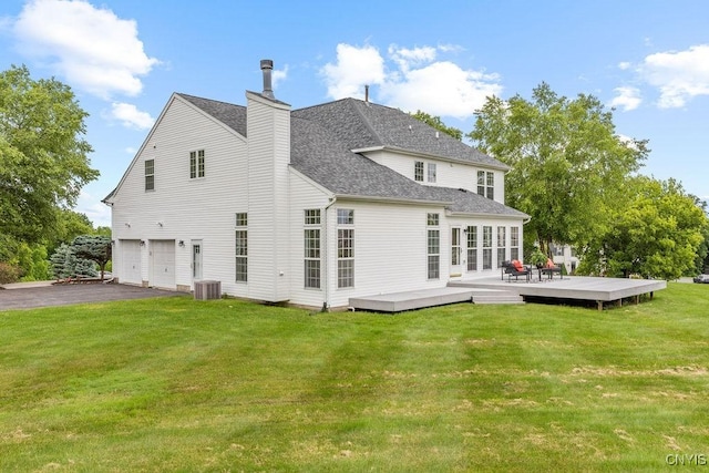 133 Raspberry Ln, Camillus, NY 13031 - rear view of property with a garage, a wooden deck, a lawn, asphalt driveway, and a shingled roof