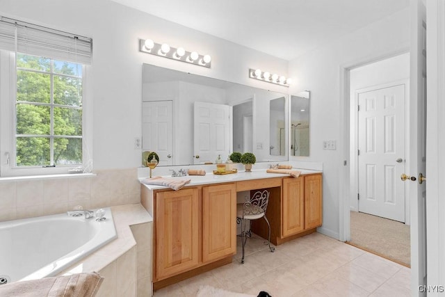 133 Raspberry Ln, Camillus, NY 13031 - bathroom with double vanity, a garden tub, and tile patterned floors