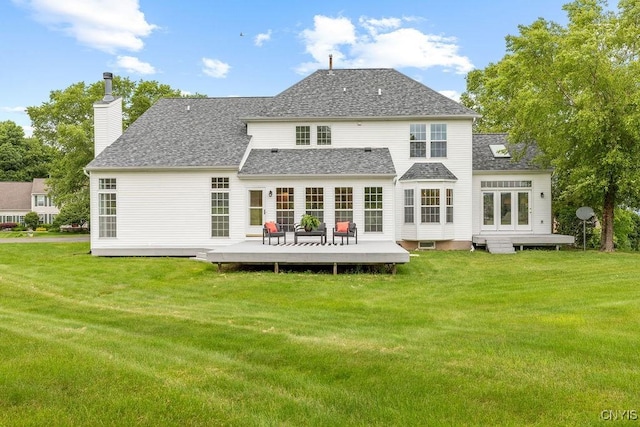 133 Raspberry Ln, Camillus, NY 13031 - back of house featuring a deck, a yard, a chimney, and a shingled roof