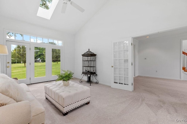 133 Raspberry Ln, Camillus, NY 13031 - living room with high vaulted ceiling, a ceiling fan, carpet floors, french doors, and a skylight