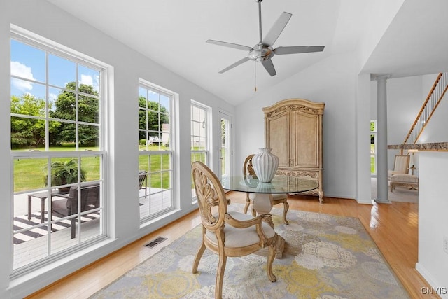 133 Raspberry Ln, Camillus, NY 13031 - dining space with light wood-style floors, vaulted ceiling, and ceiling fan