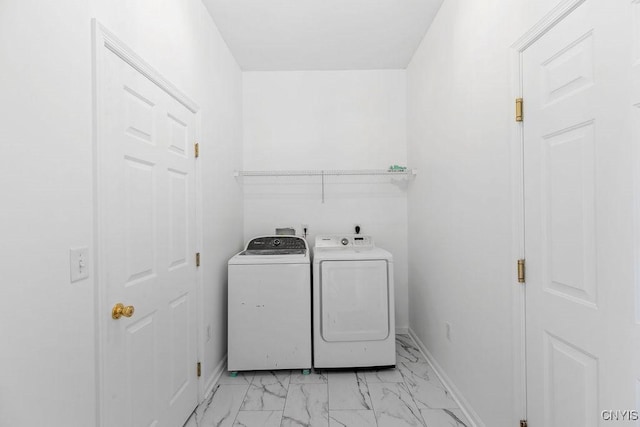 133 Raspberry Ln, Camillus, NY 13031 - laundry room featuring washing machine and clothes dryer and light marble finish floors