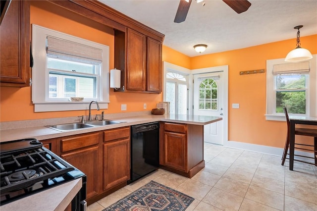 67 Macbeth St, Rochester, NY 14609 - kitchen with black appliances, a peninsula, brown cabinets, and light countertops
