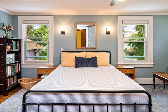 67 Macbeth St, Rochester, NY 14609 - bedroom featuring ornamental molding, multiple windows, and wood finished floors