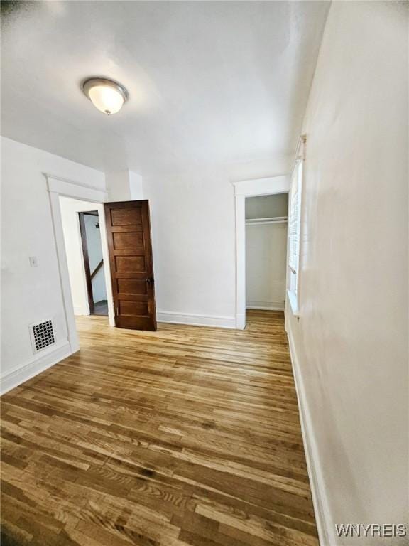 269 Westminster Ave, Buffalo, NY 14215 - unfurnished bedroom with wood finished floors and a closet
