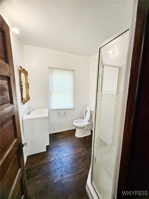 269 Westminster Ave, Buffalo, NY 14215 - full bath featuring vanity, a stall shower, and wood finished floors