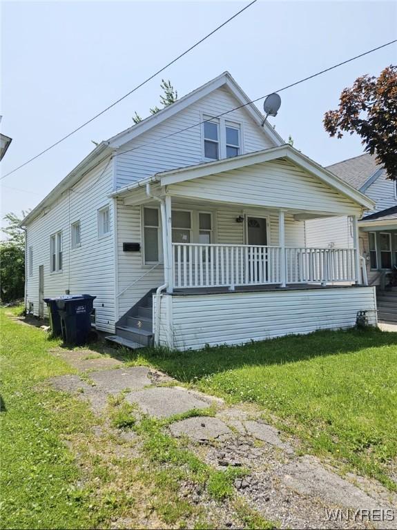 269 Westminster Ave, Buffalo, NY 14215 - bungalow-style home with covered porch and a front lawn