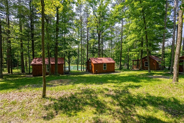 6684 Bishop Rd, Conesus, NY 14435 - view of grassy yard featuring a storage shed
